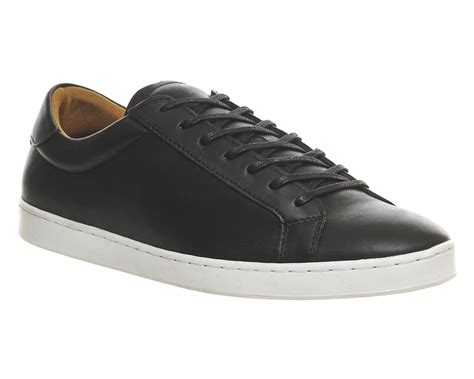 white soled black trainers.